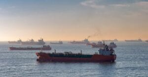 Cargo ships and oil tankers on the Bosporus strait, capturing global trade and maritime logistics at sunset.