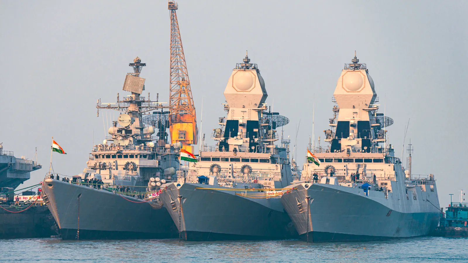 3 indian warships docked on port, a representation of indian naval power